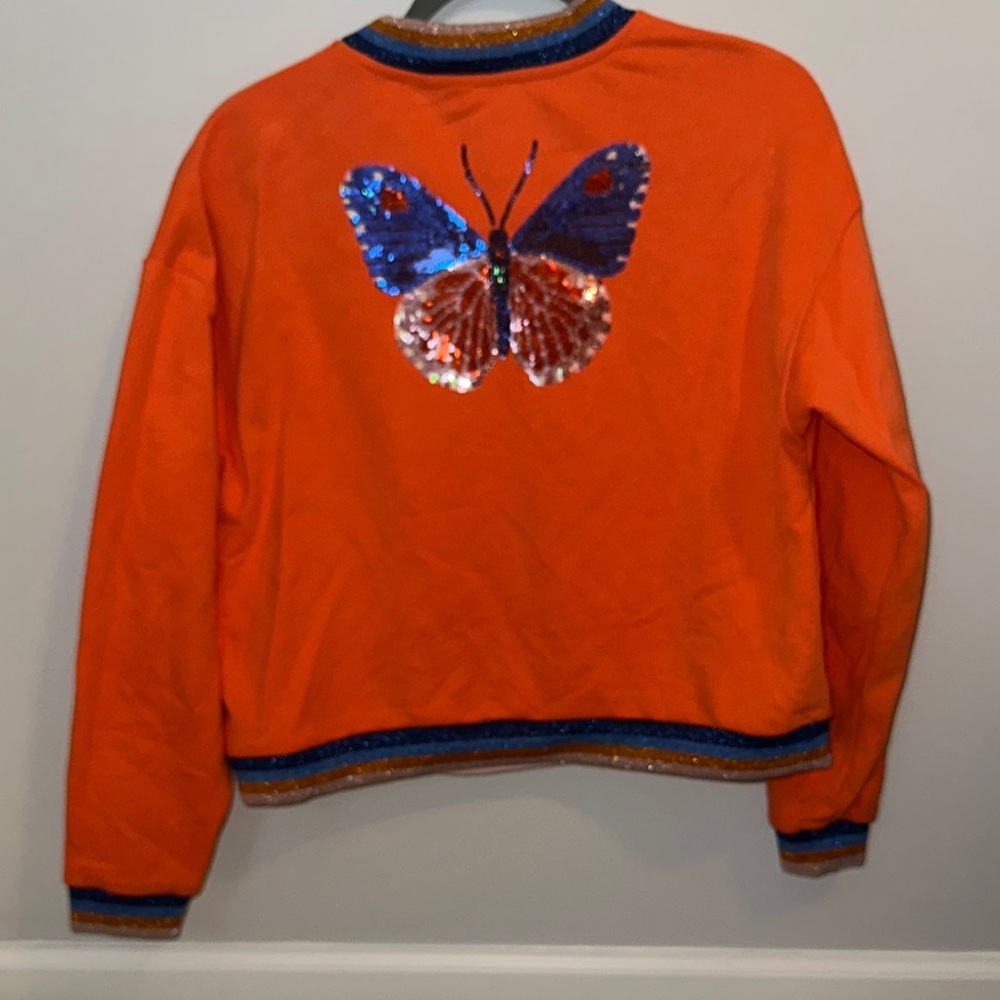 QUEEN OF SPARKLES Orange Sweatshirt with Sequin Butterfly.  Girl XL